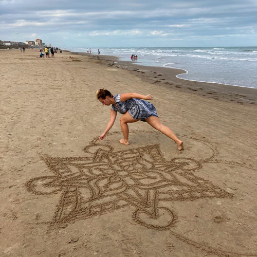 Mandala drawn in the sand